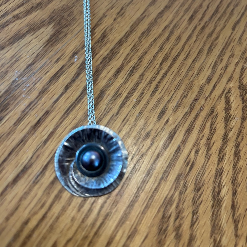Hand hammered silver pendant with black pearl centre from one of a kind …